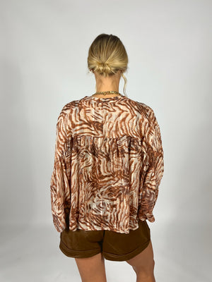 Caught In Motion Blouse