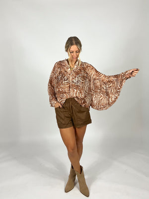 Caught In Motion Blouse